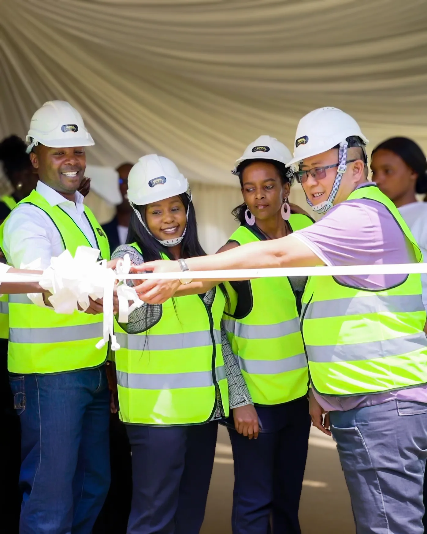 The Opal Suites team cutting the ribbon at the site groundbreaking
